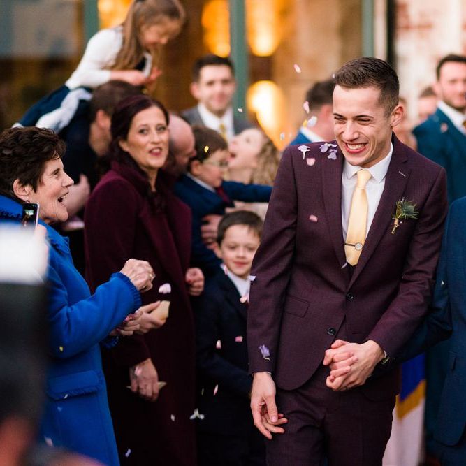 Confetti Moment with Grooms in Burgundy and Navy Remus Uomo Suits