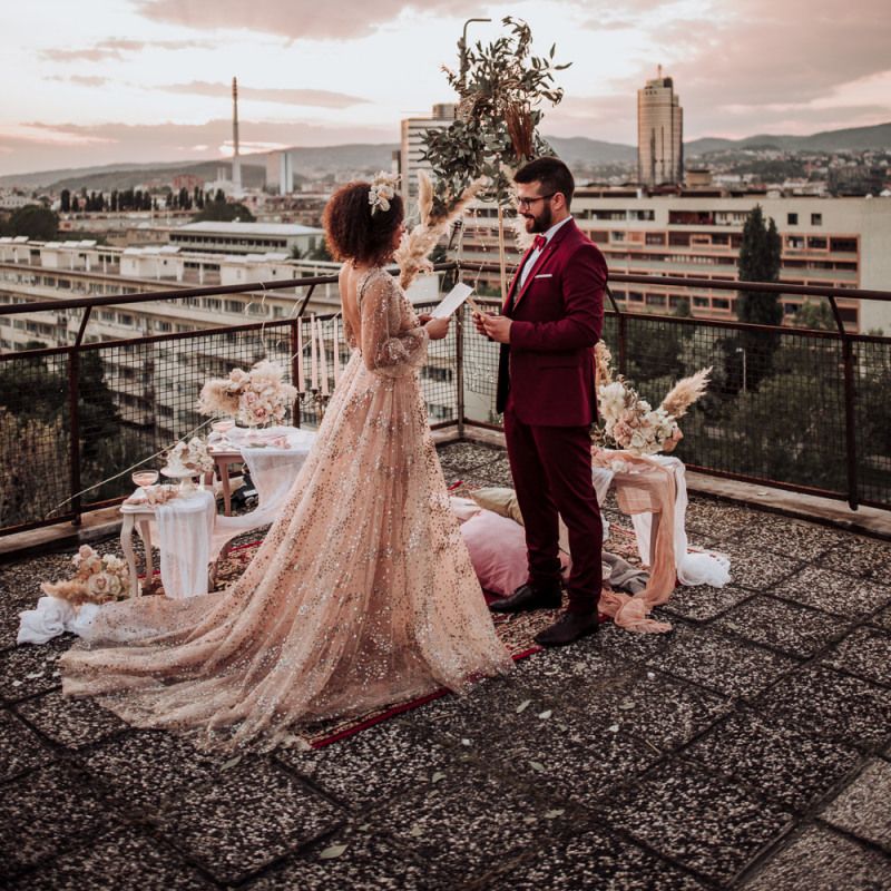 Intimate, rooftop wedding with boho styling
