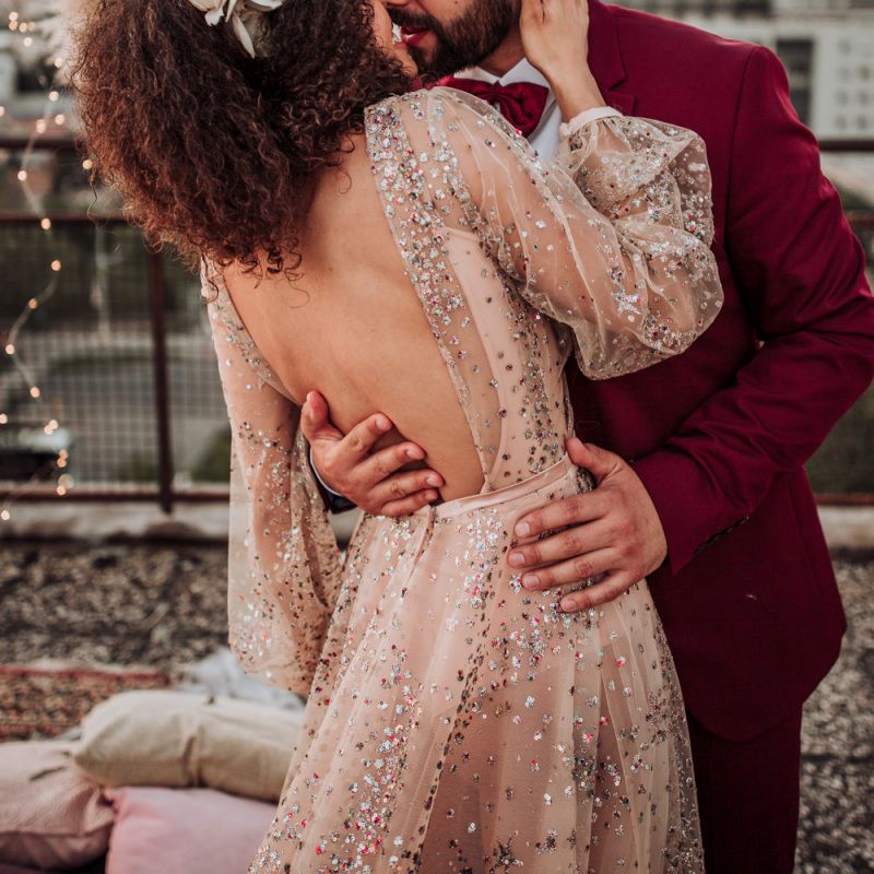 Bride in colourful sparkle wedding dress with backless detail