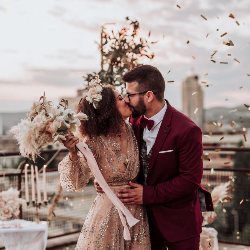 Confetti moment at intimate rooftop wedding