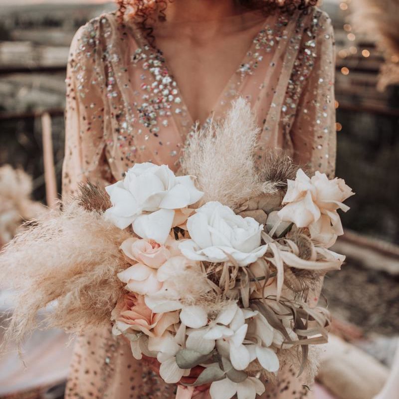 Neutral wedding bouquet with roses, orchids and pampas grass