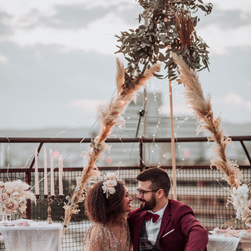 Boho picnic on the roof with rugs, cushions and naked tipi backdrop