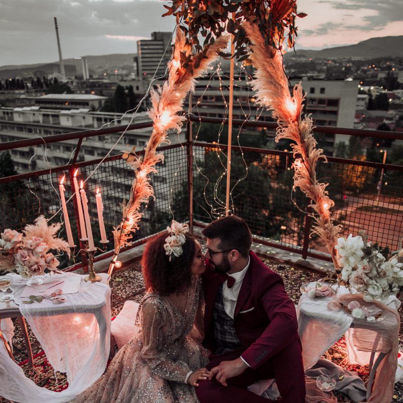 Intimate rooftop wedding with naked tipi covered in fairy lights