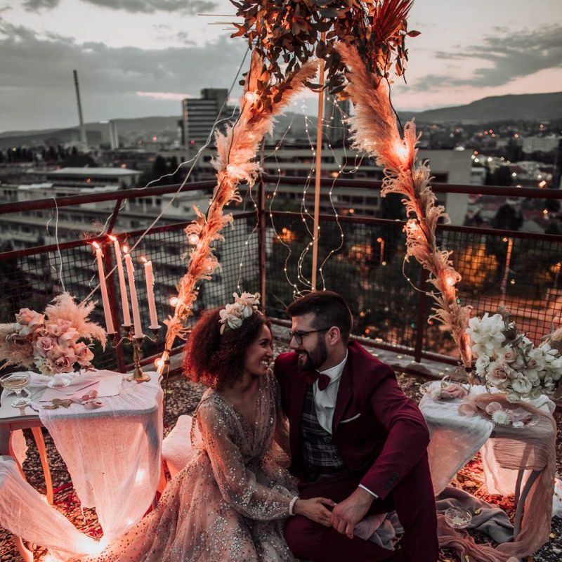 Intimate rooftop picnic with boho wedding styling