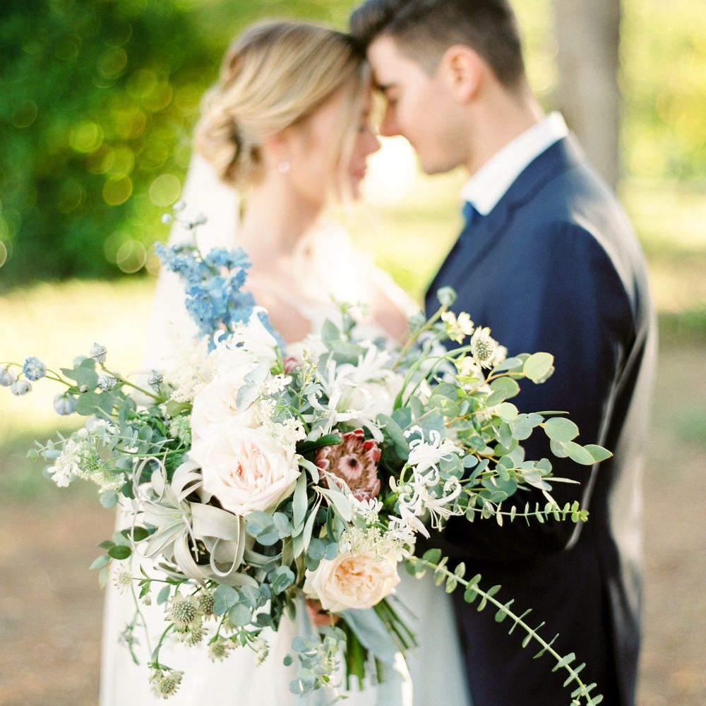 Oversized Bridal Bouquet | Bride in Coloured Hayley Paige Wedding Dress | Groom in Black Tie Suit | Pastel Blue &amp; Green, Romantic, Destination Wedding at Corfu Luxury Villas, Planned by Rosmarin Weddings &amp; Events | Mikhail Balygin Fine Art Wedding Photographer