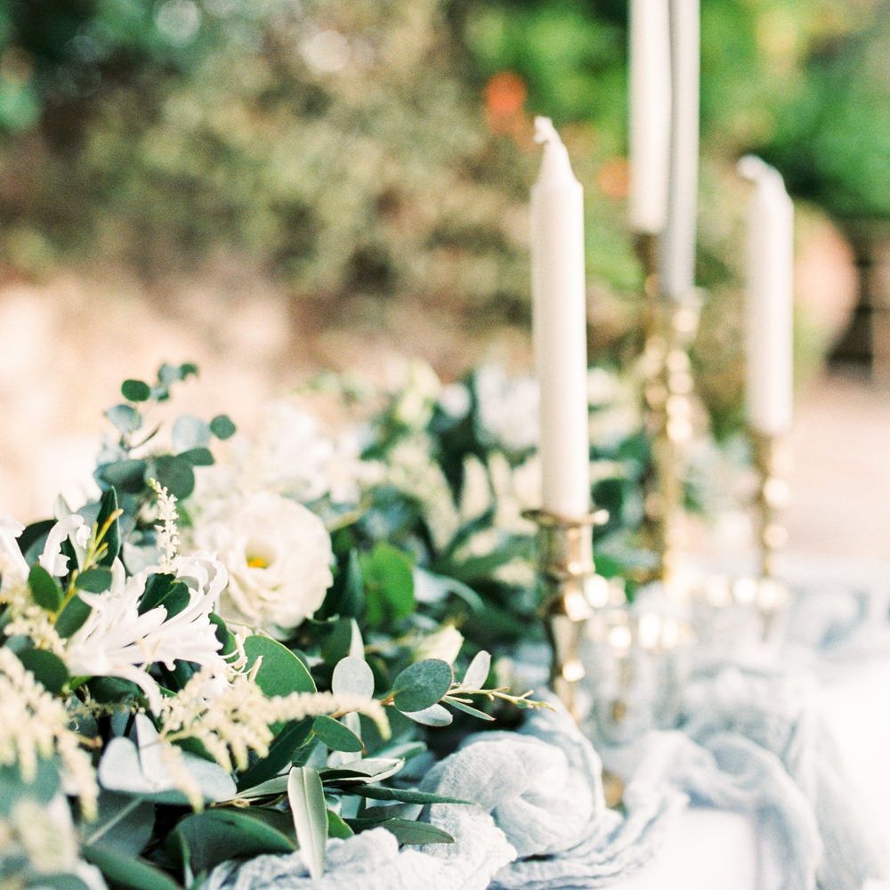 Elegant Tablescape with Coloured Goblets, Floral Table Runner, Taper Candles &amp; Geode Name Place | Pastel Blue &amp; Green, Romantic, Destination Wedding at Corfu Luxury Villas, Planned by Rosmarin Weddings &amp; Events | Mikhail Balygin Fine Art Wedding Photographer