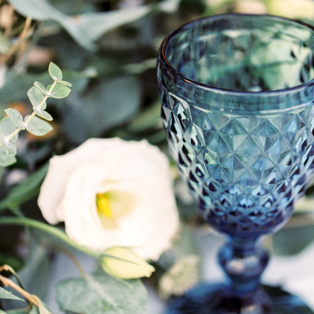Elegant Tablescape with Coloured Goblets, Floral Table Runner, Taper Candles &amp; Geode Name Place | Pastel Blue &amp; Green, Romantic, Destination Wedding at Corfu Luxury Villas, Planned by Rosmarin Weddings &amp; Events | Mikhail Balygin Fine Art Wedding Photographer