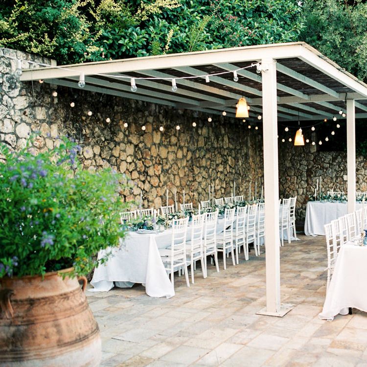 Elegant Tablescape with Coloured Goblets, Floral Table Runner, Taper Candles &amp; Geode Name Place | Pastel Blue &amp; Green, Romantic, Destination Wedding at Corfu Luxury Villas, Planned by Rosmarin Weddings &amp; Events | Mikhail Balygin Fine Art Wedding Photographer
