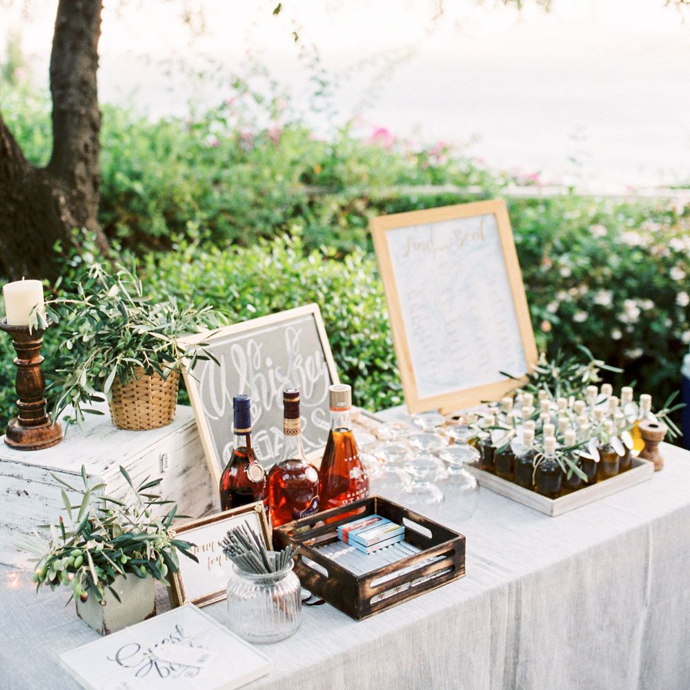 Whiskey &amp; Cigar Bar, Olive Oil Favours and Table Plan Wedding Decor | Pastel Blue &amp; Green, Romantic, Destination Wedding at Corfu Luxury Villas, Planned by Rosmarin Weddings &amp; Events | Mikhail Balygin Fine Art Wedding Photographer