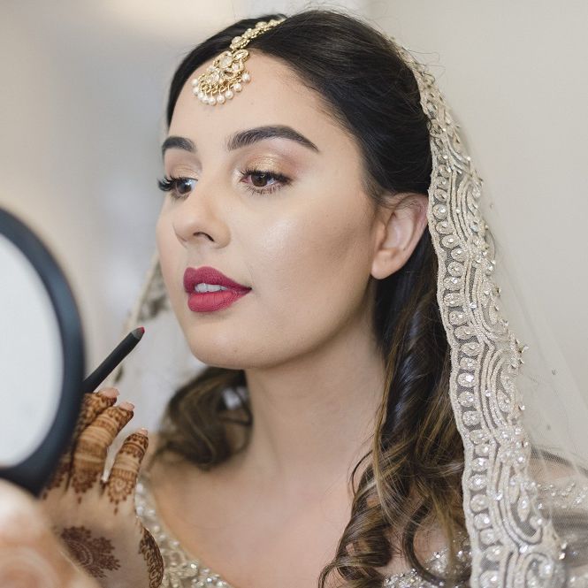 Dark pink lipstick for bride