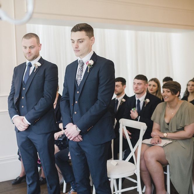 Groom waiting for bride at altar