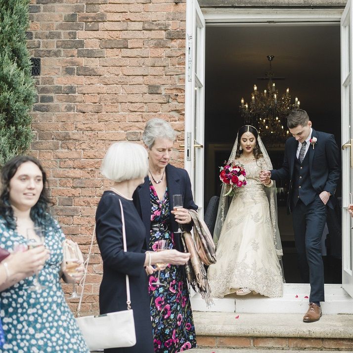Confetti exit for bride and groom at hotel wedding venue