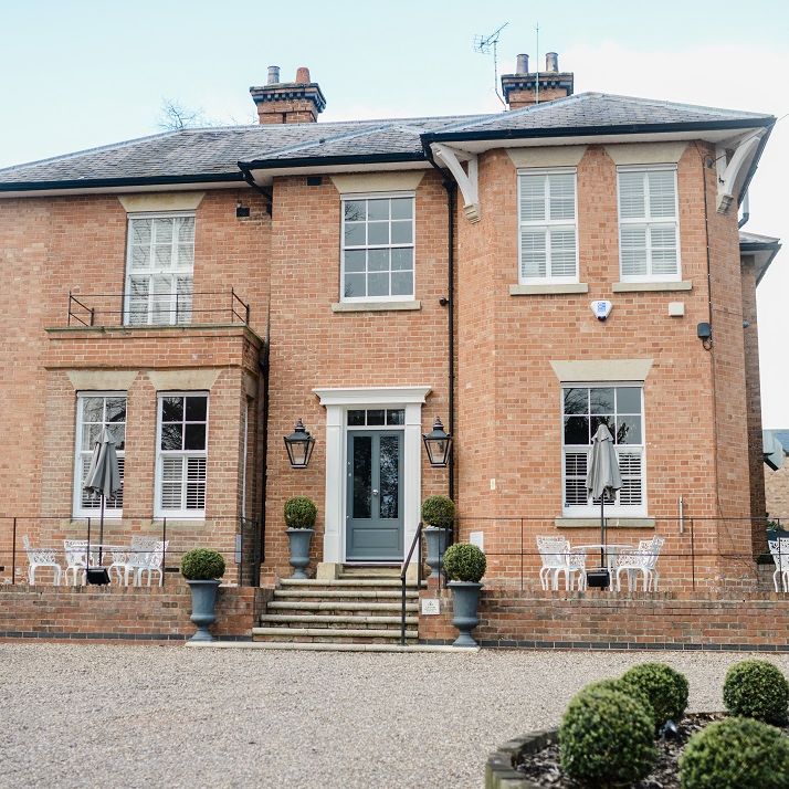 Boutique hotel wedding venue for fusion wedding with red bridesmaid dresses