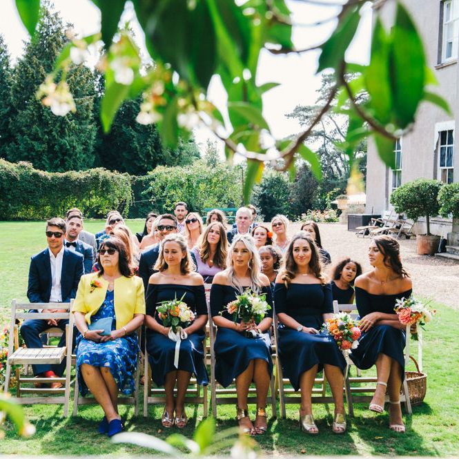 Wedding Ceremony | Bridesmaids in Navy ASOS Dresses | Bright Bouquets of Dahlias | Colourful Pennard House Wedding With Bride Wearing Racerback Alexander Wang Dress | Allison Dewey Photography