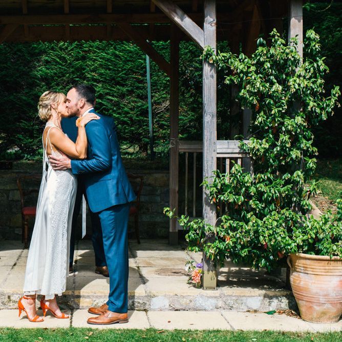 Wedding Ceremony | Bride in Racerback Alexander Wang Wedding Dress | Groom in Blue Ted Baker Suit | Colourful Pennard House Wedding | Allison Dewey Photography