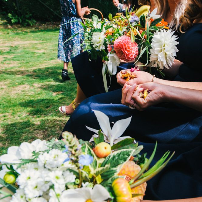 Wedding Ceremony | Bridesmaids in Navy ASOS Dresses | Bright Bouquets of Dahlias | Colourful Pennard House Wedding With Bride Wearing Racerback Alexander Wang Dress | Allison Dewey Photography
