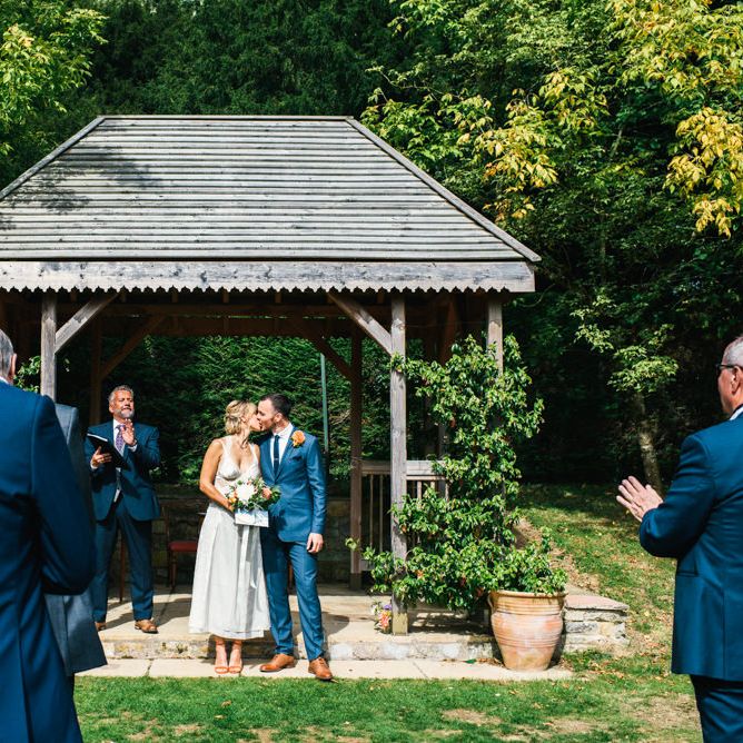 Wedding Ceremony | Bride in Racerback Alexander Wang Wedding Dress | Groom in Blue Ted Baker Suit | Colourful Pennard House Wedding | Allison Dewey Photography