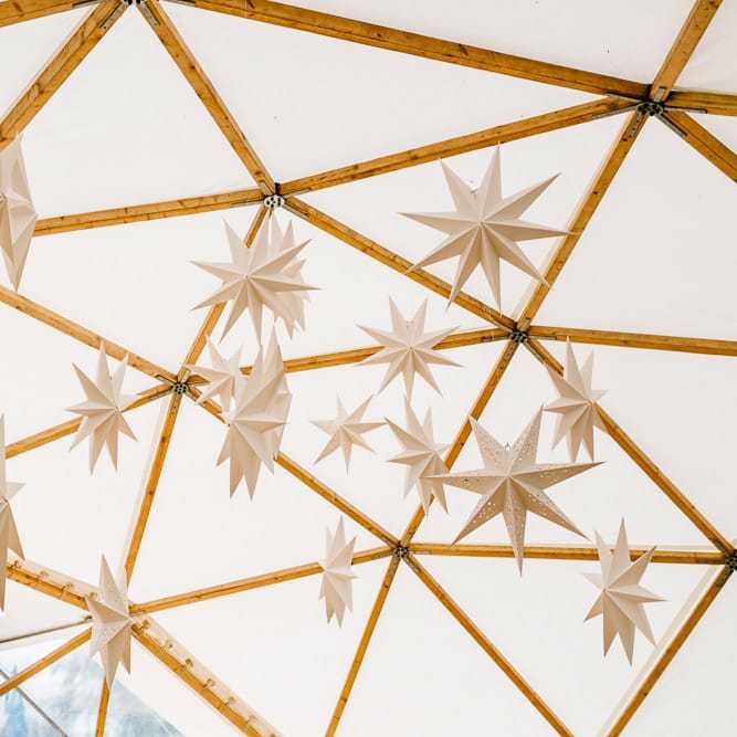 Star Lanterns For Wedding // Bride In Floral Dress By Stephanie Allin Festival Wedding With Food Trucks &amp; Outdoor Ceremony With Geo Dome Tent Baya Hire Epic Love Story Photography