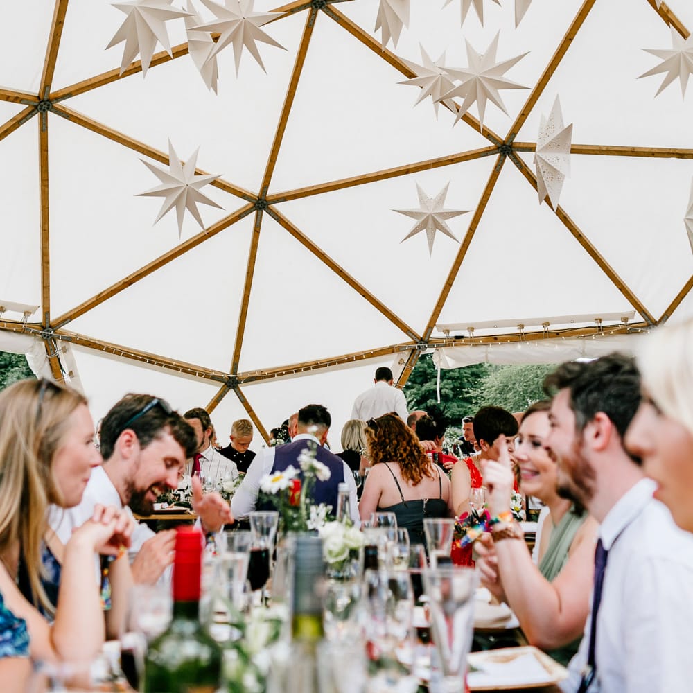 Star Lanterns For Wedding // Bride In Floral Dress By Stephanie Allin Festival Wedding With Food Trucks &amp; Outdoor Ceremony With Geo Dome Tent Baya Hire Epic Love Story Photography