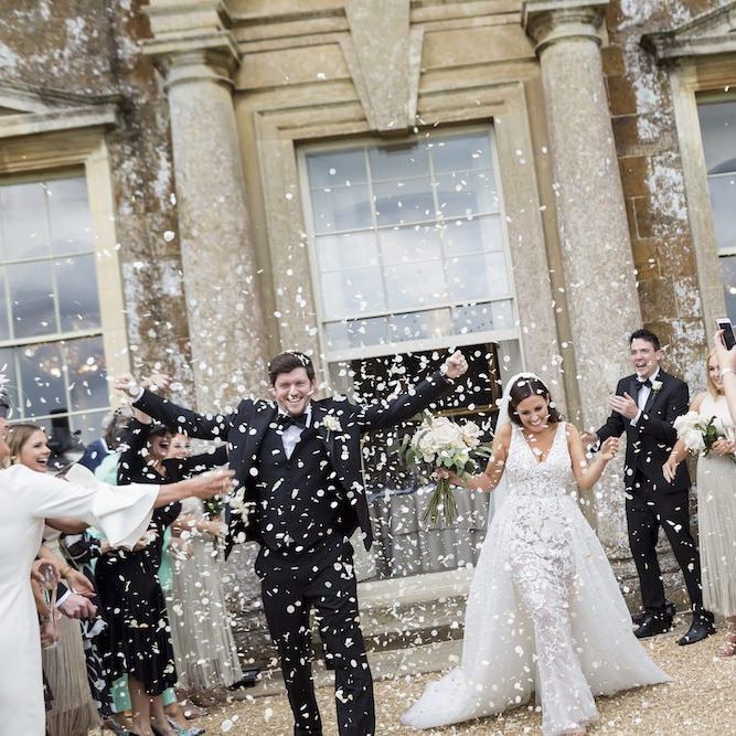 Bride and groom tie the knot at Aynhoe Park wearing Zuhair Murad dress