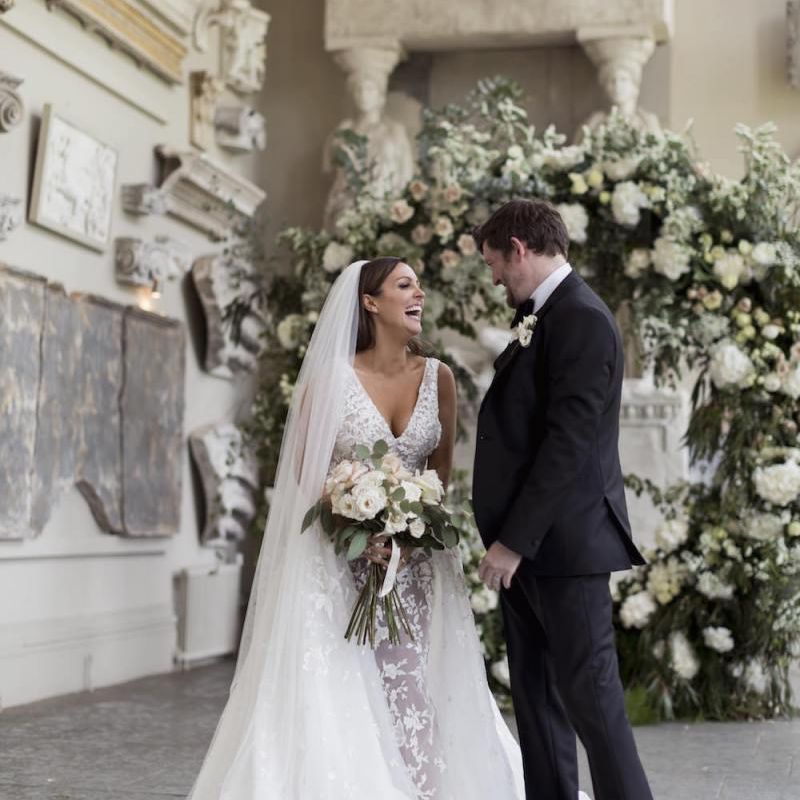 Bride and groom tie the knot at Aynhoe Park with beautiful white floral decor