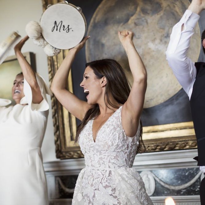 Bride and groom celebrate with their personalised tambourines