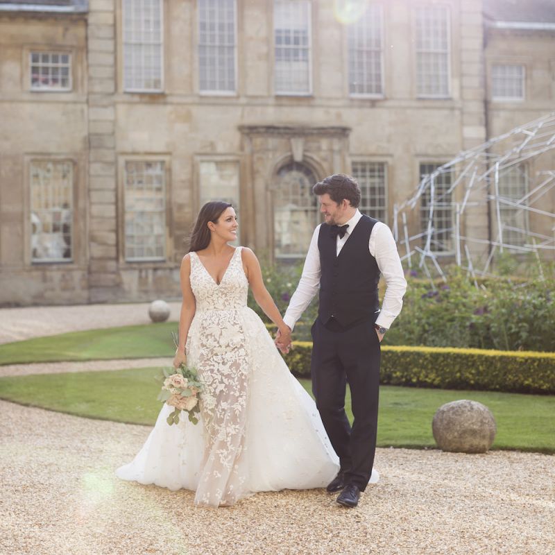 Bride and groom steal a moment with bride wearing Zuhair Murad dress