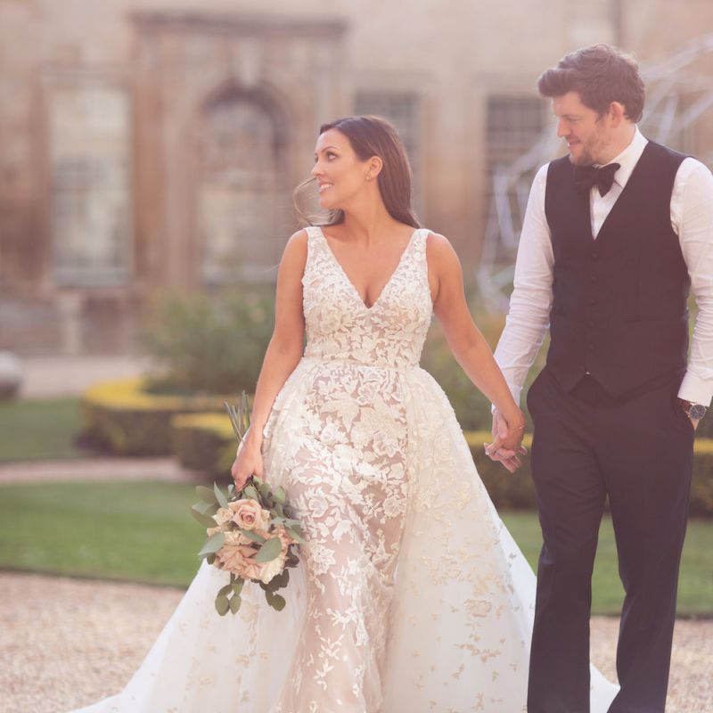 Bride and groom steal a moment with bride wearing Zuhair Murad dress