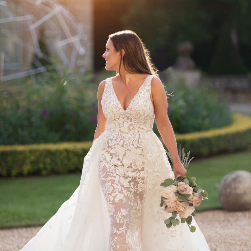 Bride and groom steal a moment with bride wearing Zuhair Murad dress
