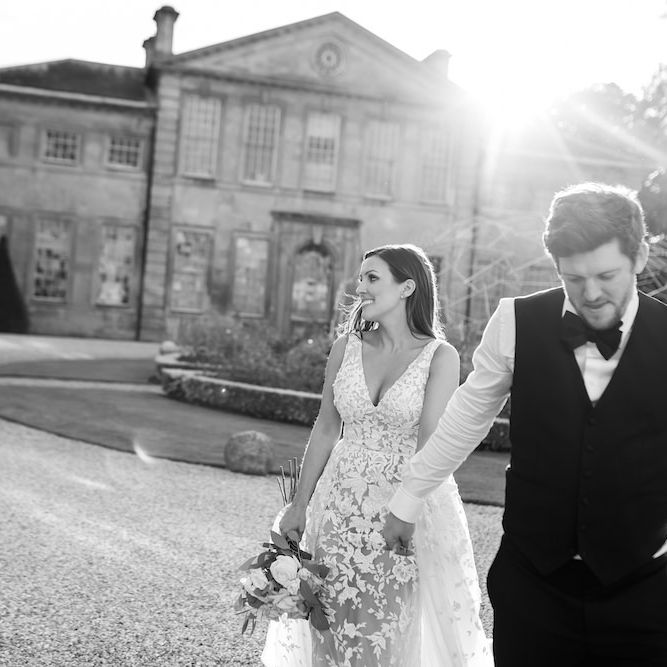 Bride and groom steal a moment with bride wearing Zuhair Murad dress