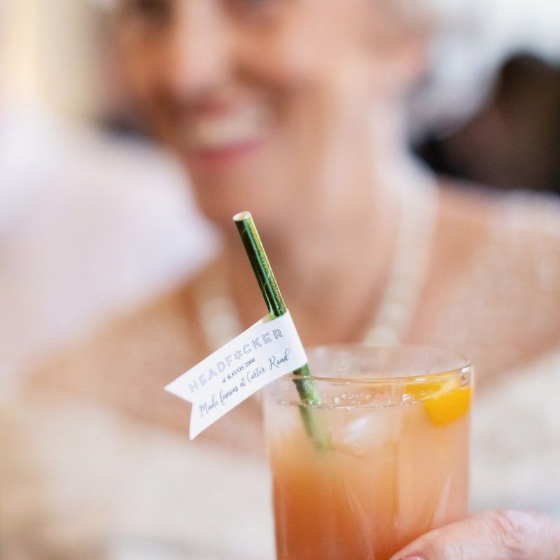 Guest enjoying a cocktail with personalised straw