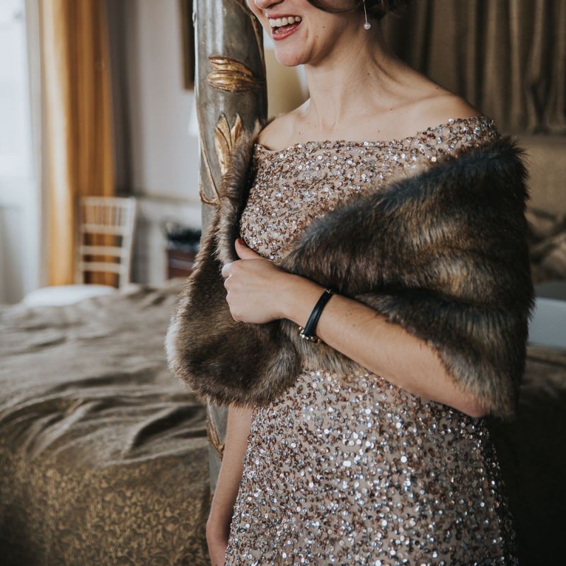 Bridesmaid In Gold Sequin Dress with Faux Fur Wrap Around