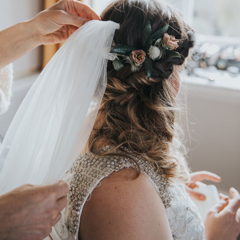Bridal Braids With Flower Accessories and Veil
