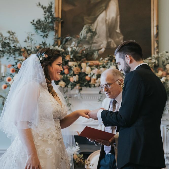 Bride and Groom Exchange Rings During Wedding Ceremony at Oxfordshire Wedding Venue