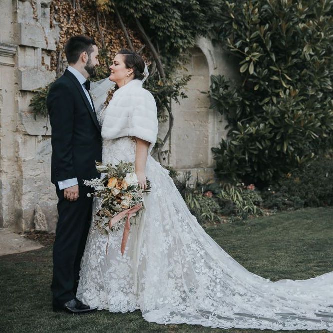 Bridal Faux Fur Cover Up For Winter Wedding With Groom In Tux at Oxfordshire Wedding Venue