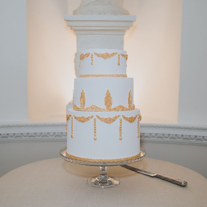 White Wedding Cake With Gold Detail