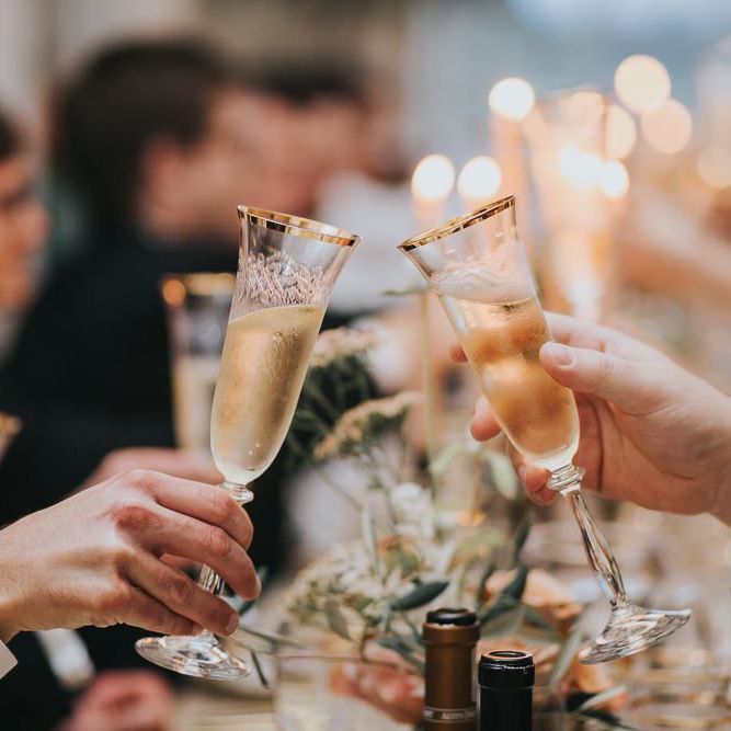 Guests Toast Bride and Groom With Champagne