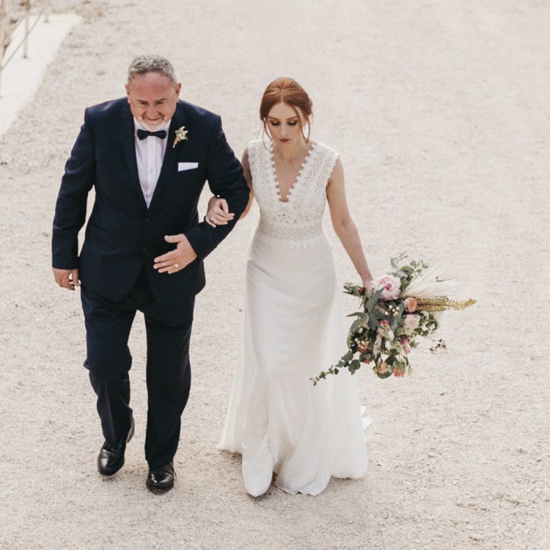 Father of the Bride in a Tuxedo and Bride in a Fitted Pronovias Wedding Dress Walking to the Wedding Ceremony