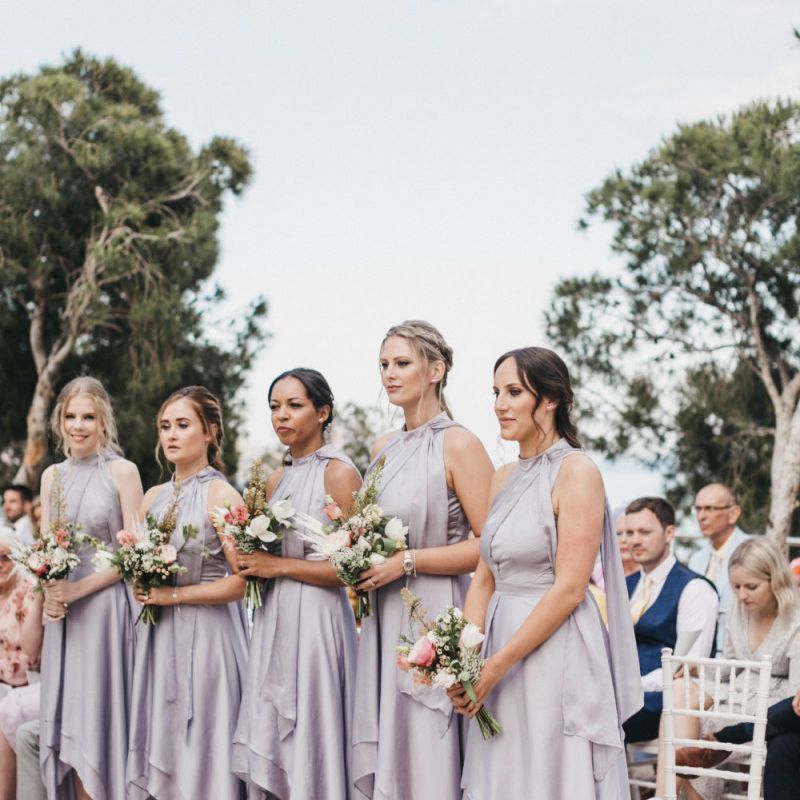 Bridesmaids in Silver Halterneck Dresses with Half Up Half Down Hemlines