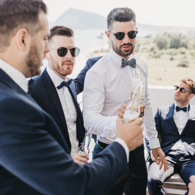 Groomsmen Sharing a Beer on the Wedding