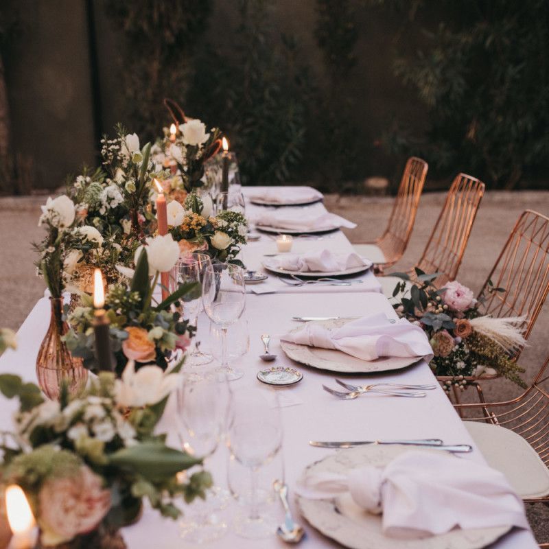 Candles and Vessels Filled with Peach Flowers