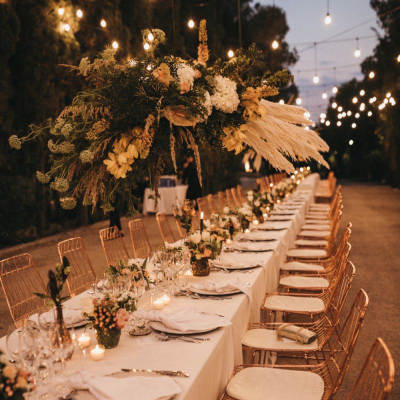 Long Wedding Reception Table with Festoon Light Canopy