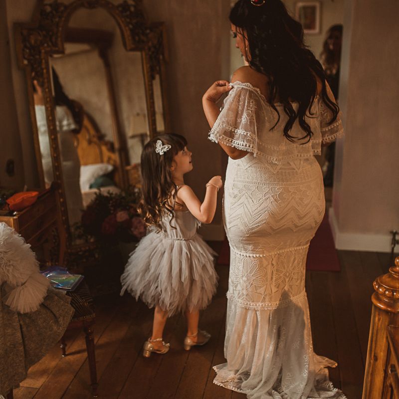 Bride in Emanuela Grace Loves Lace Off The Shoulder Wedding Dress and Daughter in a Tutu on the Wedding Morning