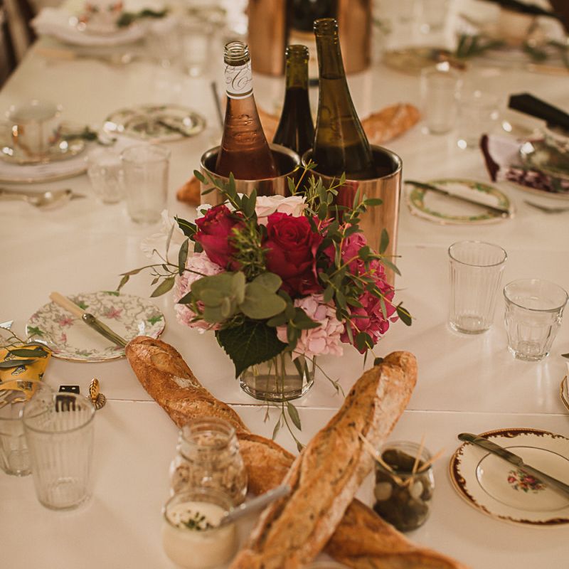 Table Decor with France Sticks and Pink Flower Centrepieces featured on escape to the chateau