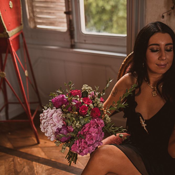 Bridesmaid Holding a Pink Rose and Hydrangea Wedding Bouquet featured on escape to the chateau