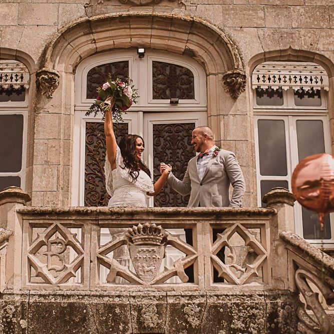 Bride and Groom Cheering on the Steps of their French Chateau de la Motte Husson Wedding