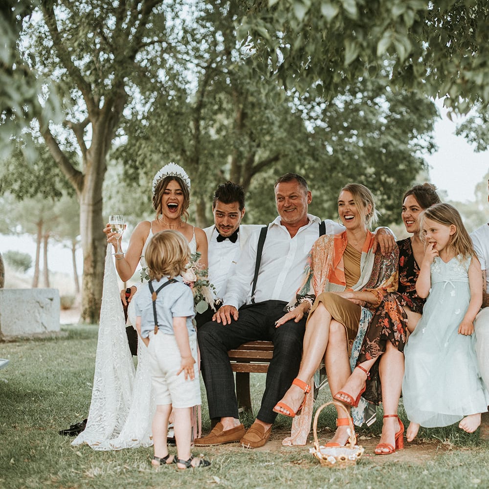 Bride In Feather Headdress With Guests