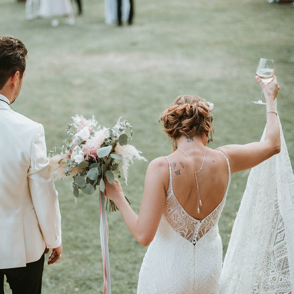 Low Back Wedding Dress With Peony Bouquet
