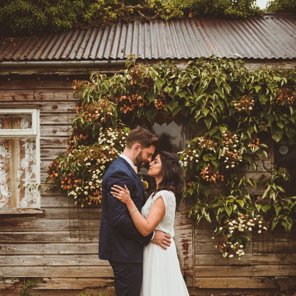 Bride in Gatsby Lady Gown | Groom in Navy Reiss Suit | Fusion Rustic Indian Country Wedding at The Green Cornwall | Matt Penberthy Photography