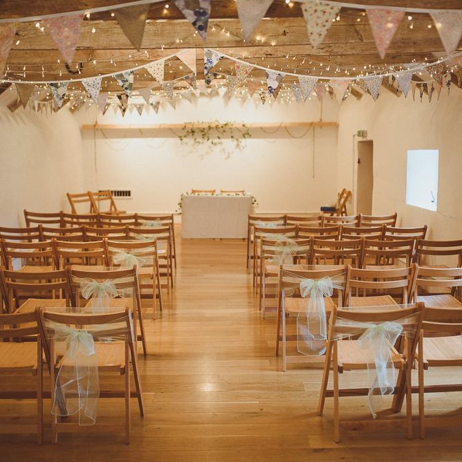Ceremony Aisle &amp; Altar Decor | Pastel Bunting &amp; Fairy Lights | Fusion Rustic Indian Country Wedding at The Green Cornwall | Matt Penberthy Photography